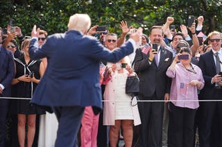 President waves in a crowd in the southern April before moving in Texas to survey floods